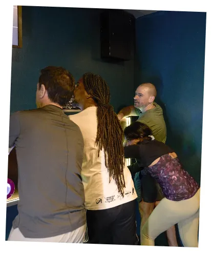 Colleagues completing indoor adventure challenges together at TEPFactor