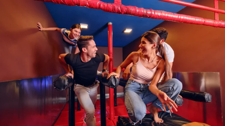Friends enjoying an indoor adventure challenge at TEPfactor during the Dubai summer