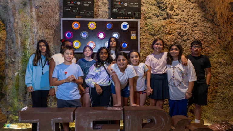 School students group photo during an indoor adventure trip at TEPfactor Dubai